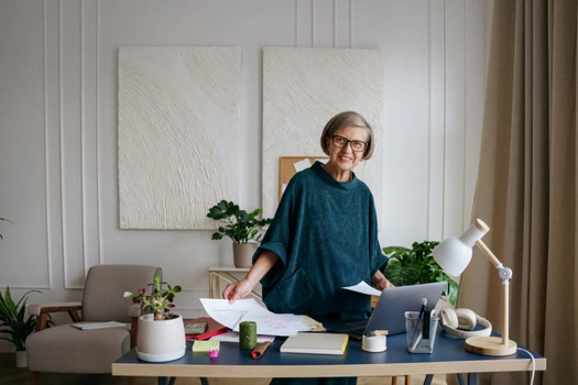 Lady at office desk taking notes